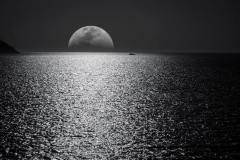 white-and-black-moon-with-black-skies-and-body-of-water-748626
